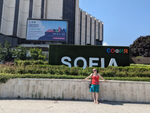 Sofia sign with Laura stood in front of it